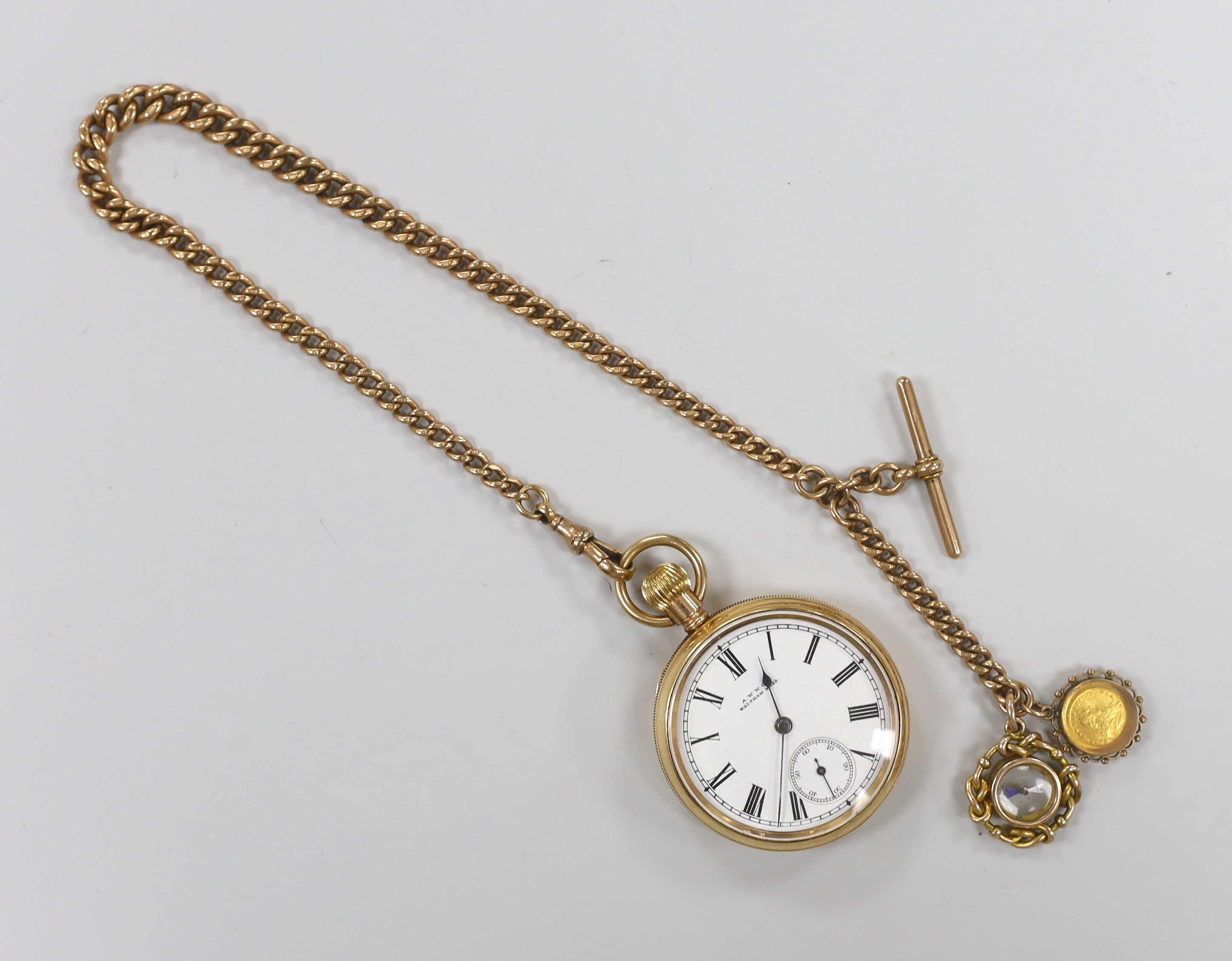 A Waltham gold plated open face pocket watch, with Roman dial and subsidiary seconds, on a 9ct gold albert hung with two fobs including compass, albert gross 54.5 grams.